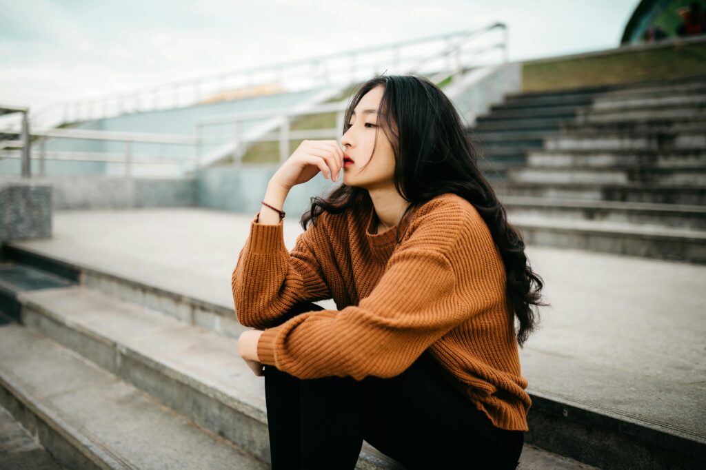 woman thinking deeply sitting